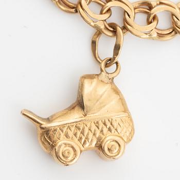 Bracelet, 18K gold bismarck link. With charms.