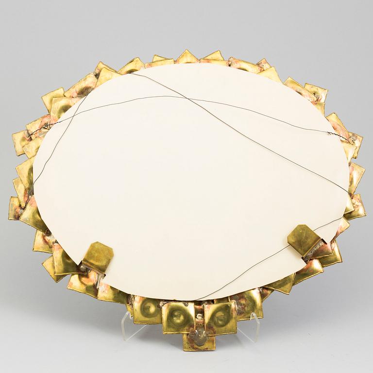 A brass mirror by Claës Giertta.