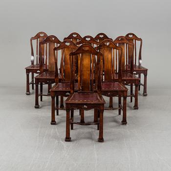 A late 19th century dining table with ten chairs and five extension leaves.