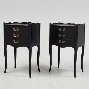 a pair of rococo-style bedside tables.