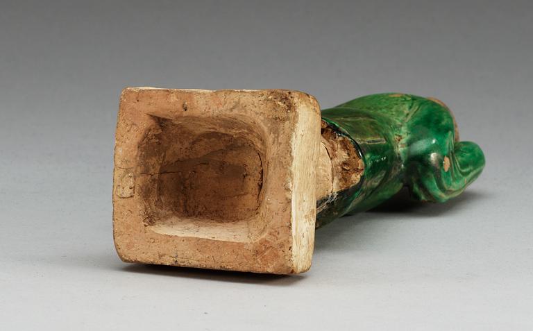 A green glazed figure of a man, Ming dynasty.