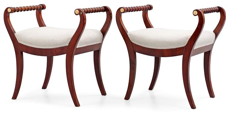 A pair of Swedish Empire first half 19th century stools.