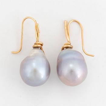 A pair of earrings with cultured baroque South Sea pearl.