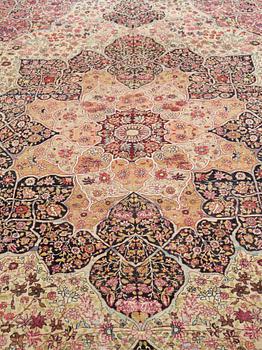 An antique Kerman Laver carpet, c. 586 x 385 cm.