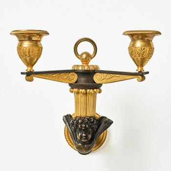 A pair of Empire patinated and ormolu two-branch appliques attr. to C. Galle (bronzier in Paris 1786-1815).