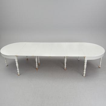 A mid 19th century dining table with six extension leaves.