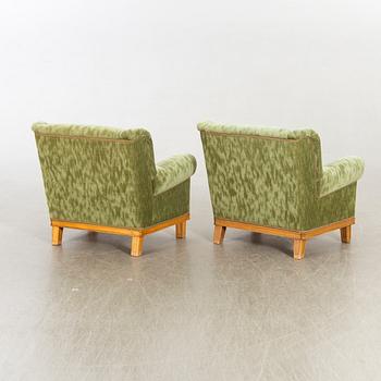 A pair of Swedish Modern lounge chairs.