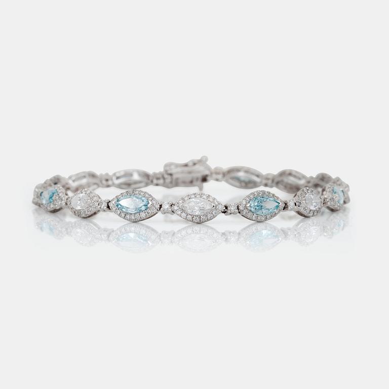 A colourless marquise-cut and blue treated diamond bracelet.