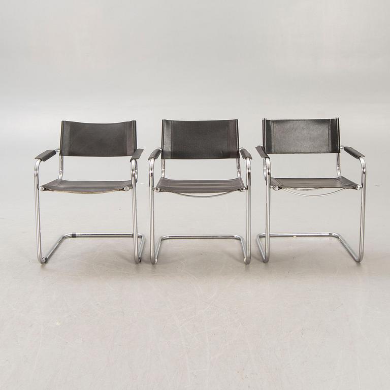 A set of five similar Italian 1970s chrome and leather armchairs.