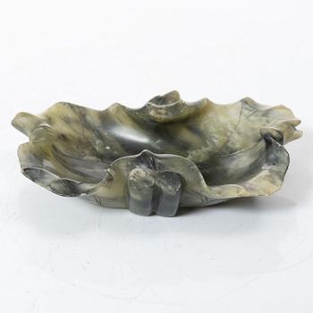 A Chinese green stone brush washer, a carved bone and a soapstone figure, partly Qing dynasty.