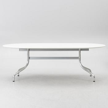 Vico Magistretti, a "Shine" dining table with twelve chairs, De Padova, Italy, around the year 2000.