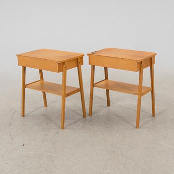 A pair of veneered bedside tables, 1950's/60's.