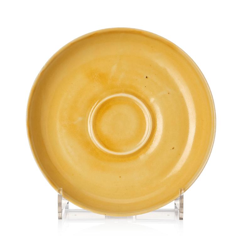 A yellow glazed cup holder, Qing dynasty with Xuandes four character mark.