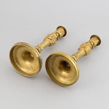 A pair of bronze Louis XV-style candlesticks, circa 1900.