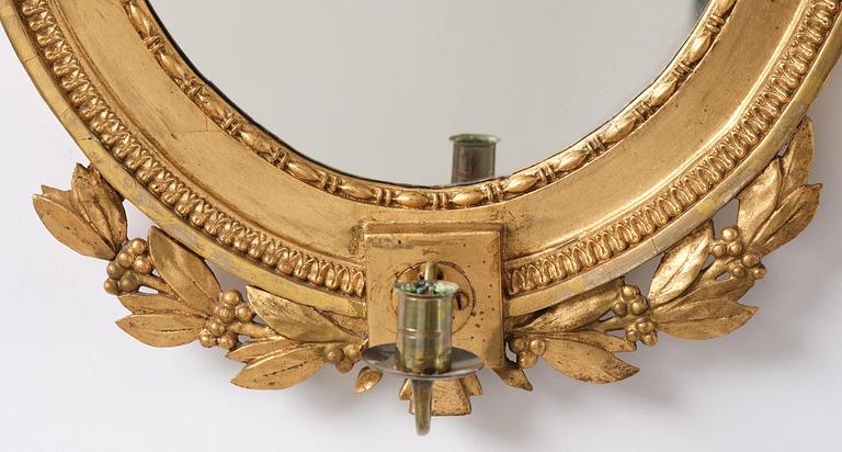 A pair of late Gustavian giltwood one light girandoles, Stockholm, circa 1800.