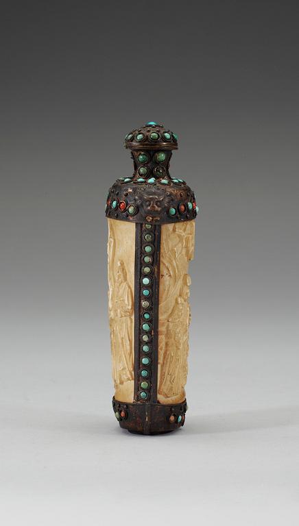 A turquoise inlayed metal framed ivory flask, late Qing dynasty (1644-1911).