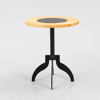 A 'Triptyk' table with an iron stand by Jonas Bohlin for Källemo, 1989.