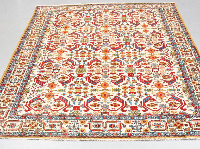 A carpet, semi-antique Qum, ca 342,5 x 222 cm.