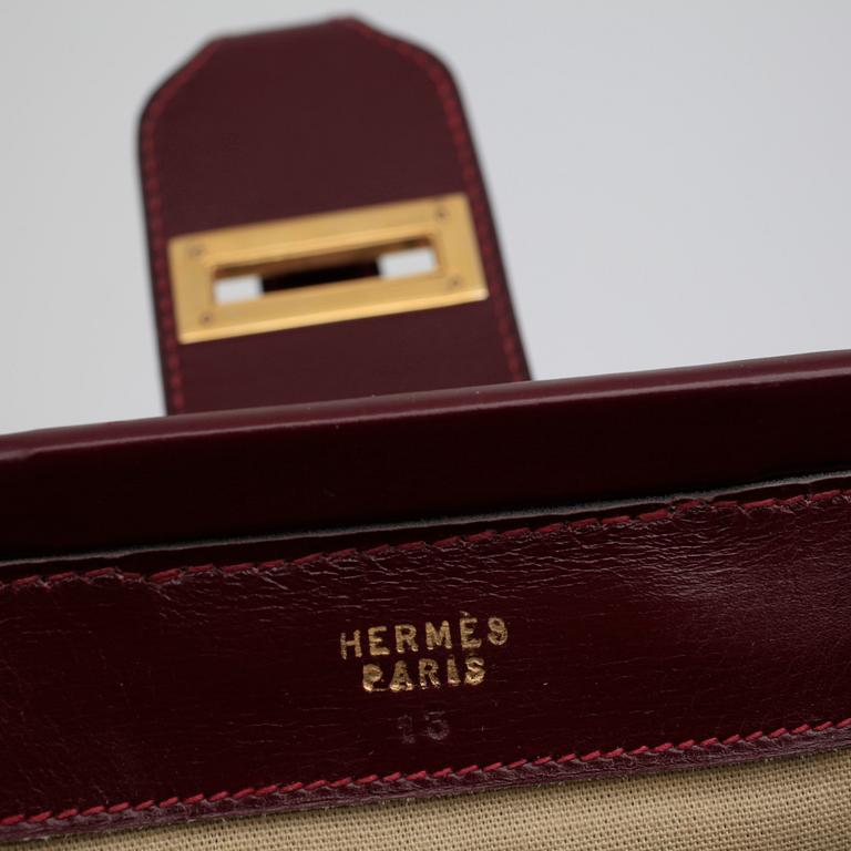 HERMÈS, a canvas and leather handbag.