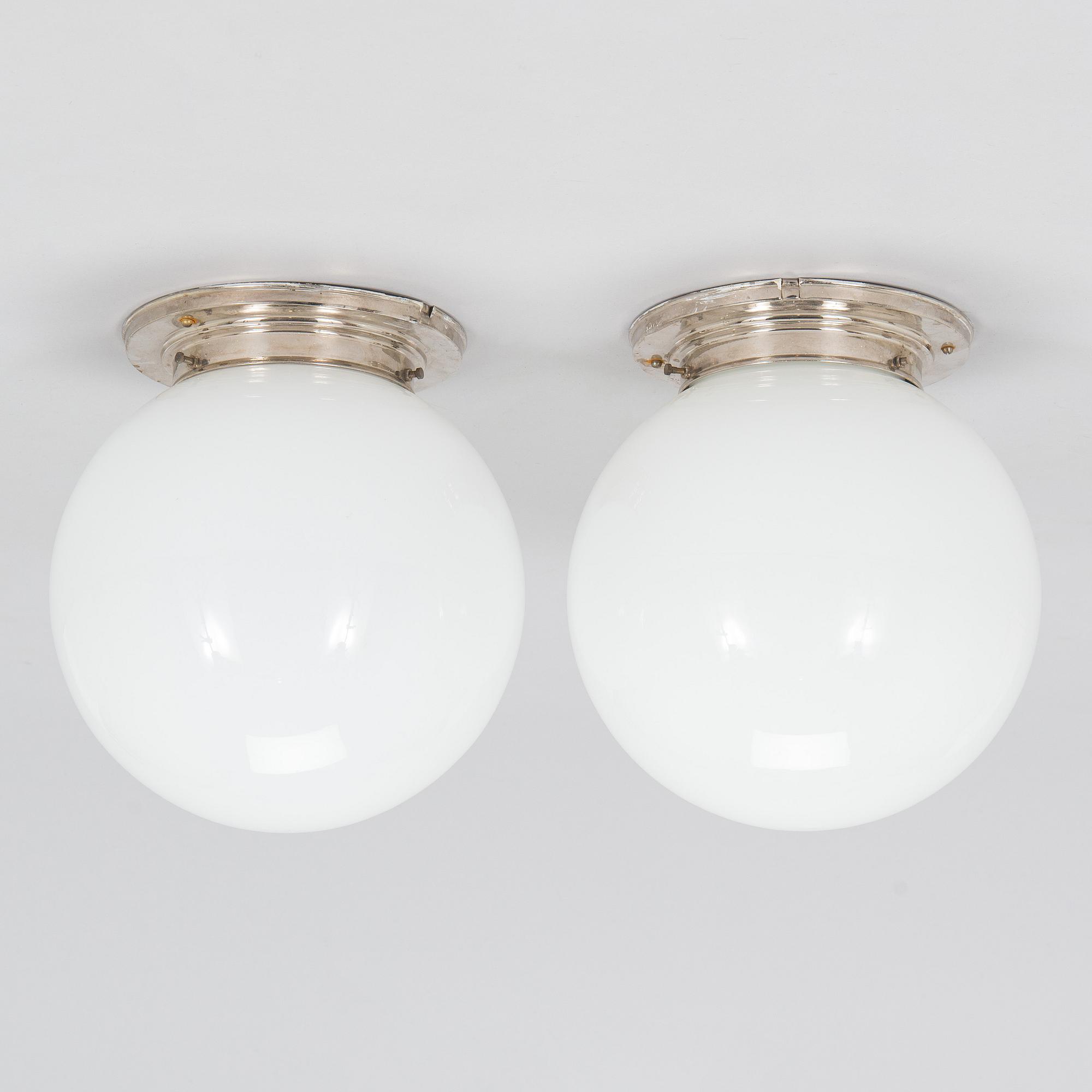 A pair of 1930s ceiling lights.