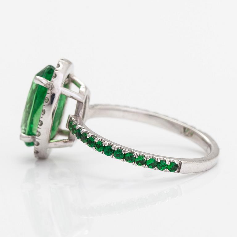 A 14K white gold ring, with tsavorite garnets and diamonds.