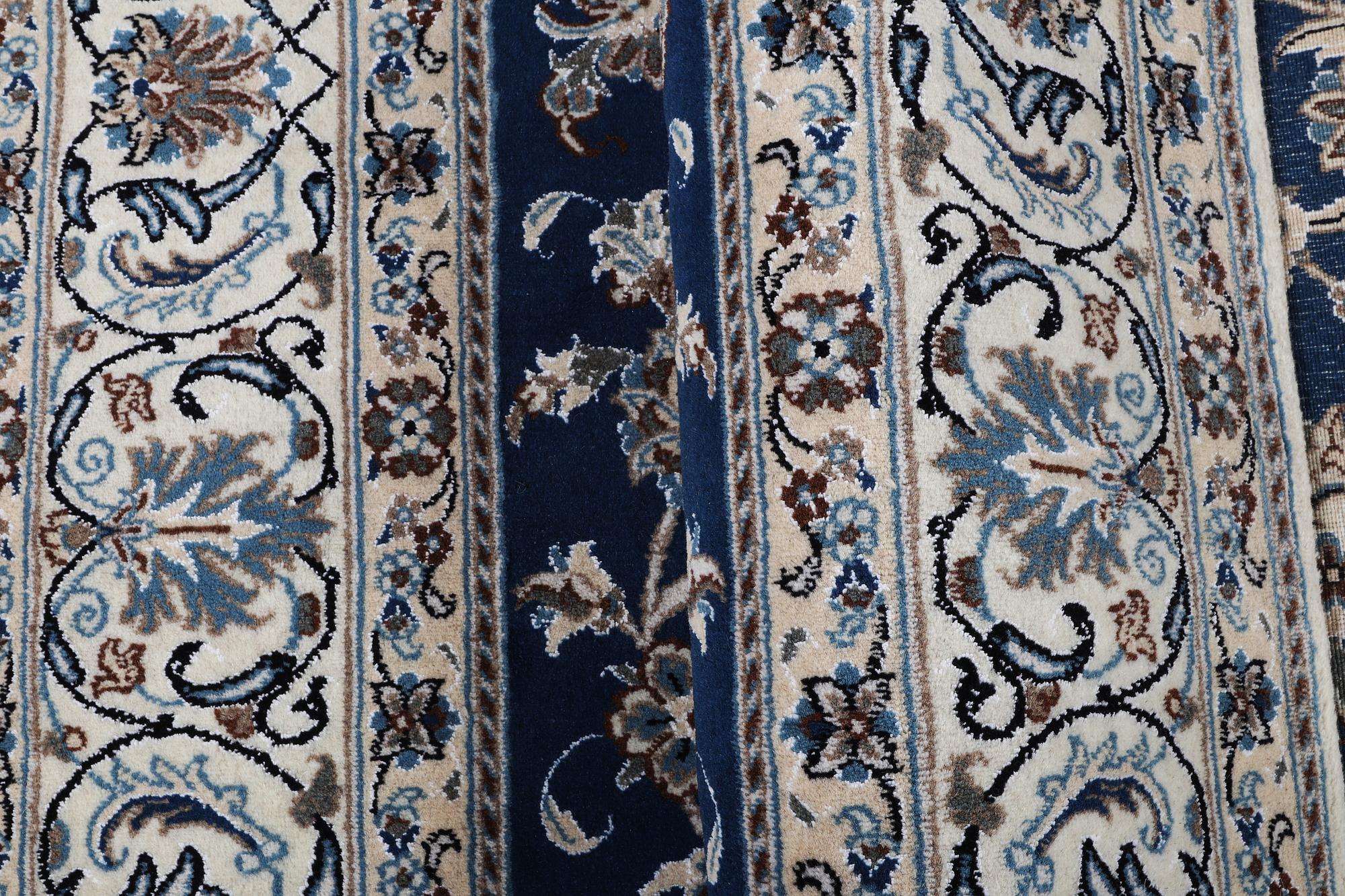 A carpet, Nain, part silk, ca 297 x 194 cm.