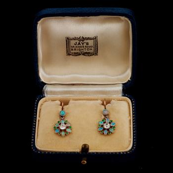 A pair of opal earrings set with demantoid garnets and old-cut diamonds.