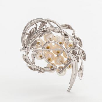 A 14K white gold brooch with cultured pearls.