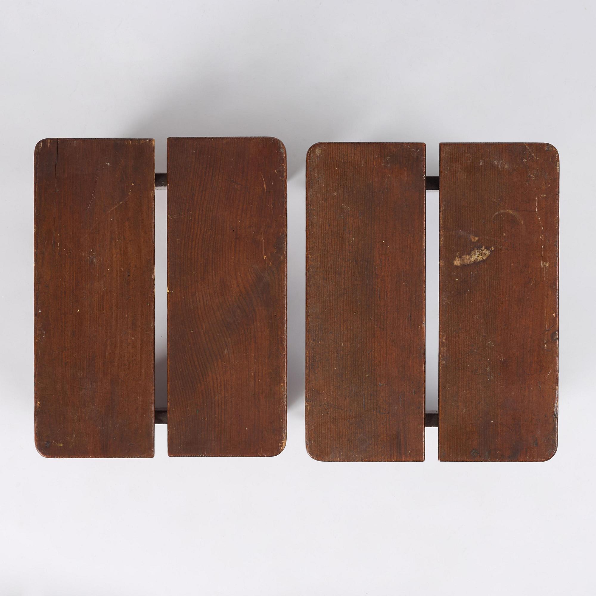 Axel Einar Hjorth, a pair of stained pine "Skoga" stools, Nordiska Kompaniet, Sweden, 1930s.