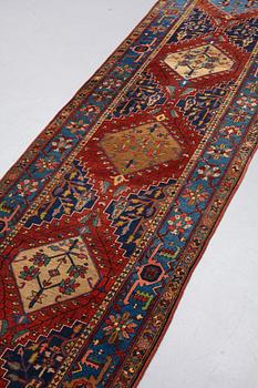 A RUNNER, a semi-antique northwest Persian, ca 421 x 96-99 cm.