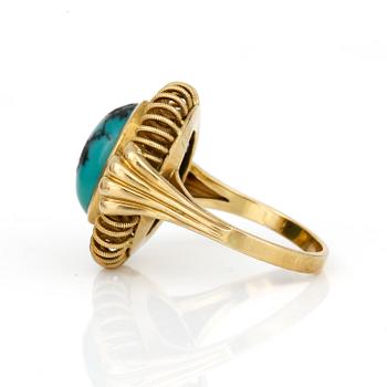 RING, med cabochonslipad turkos.