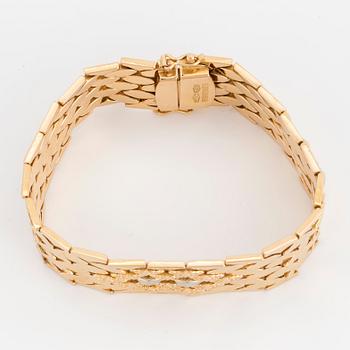 ARMBAND, guld och vitguld 18K, 16 mm brett platt, 33 gram.