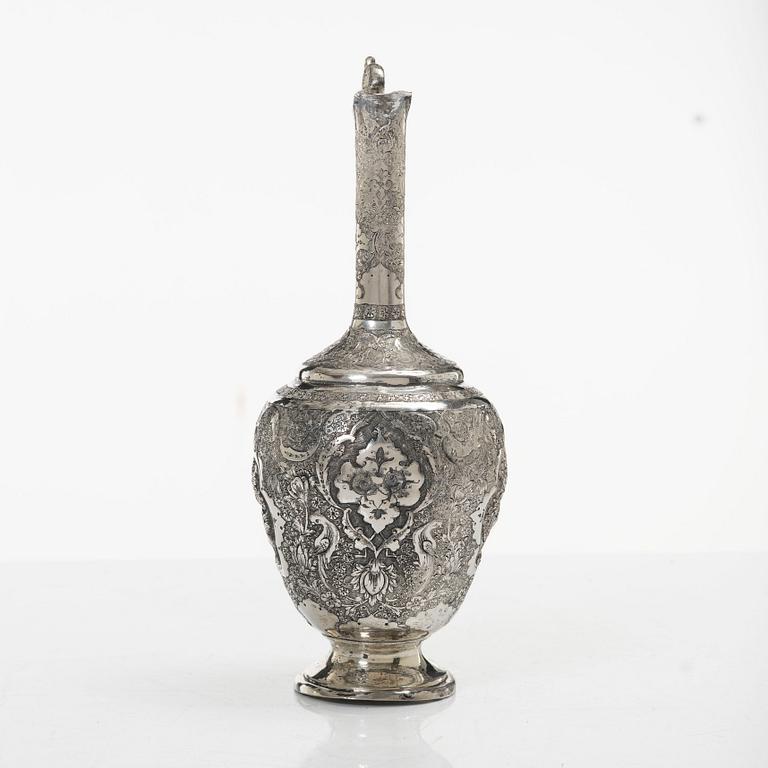 A Persian silver pitcher with five stemmed cups and a beaker, first part of the 1900s.