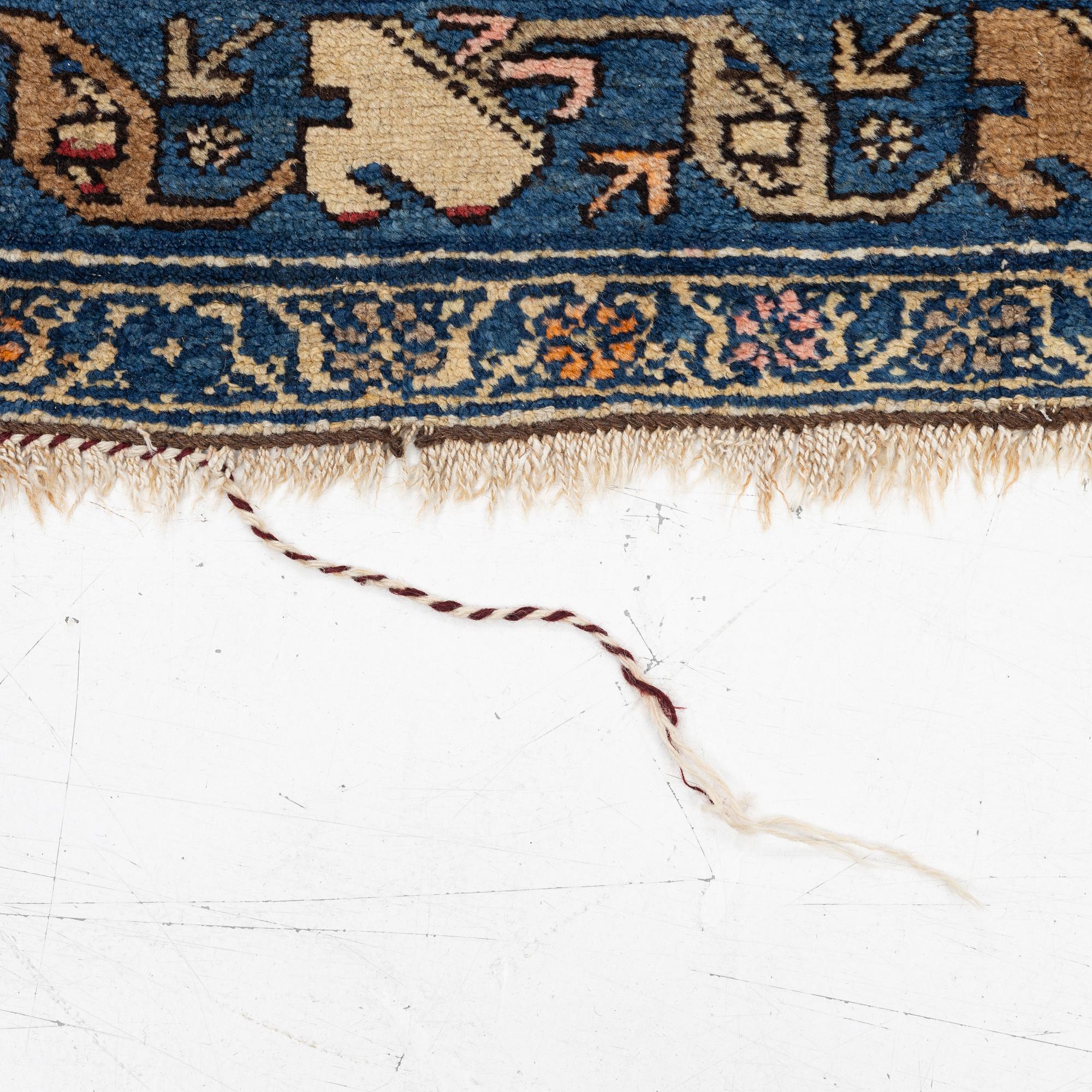 An antique Hamadan rug, c. 188 x 114 cm.