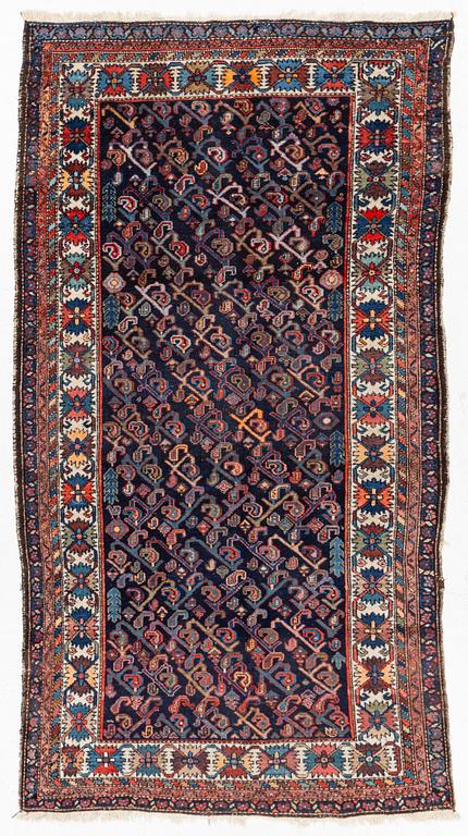 An oriental rug, c. 232 x 125 cm.