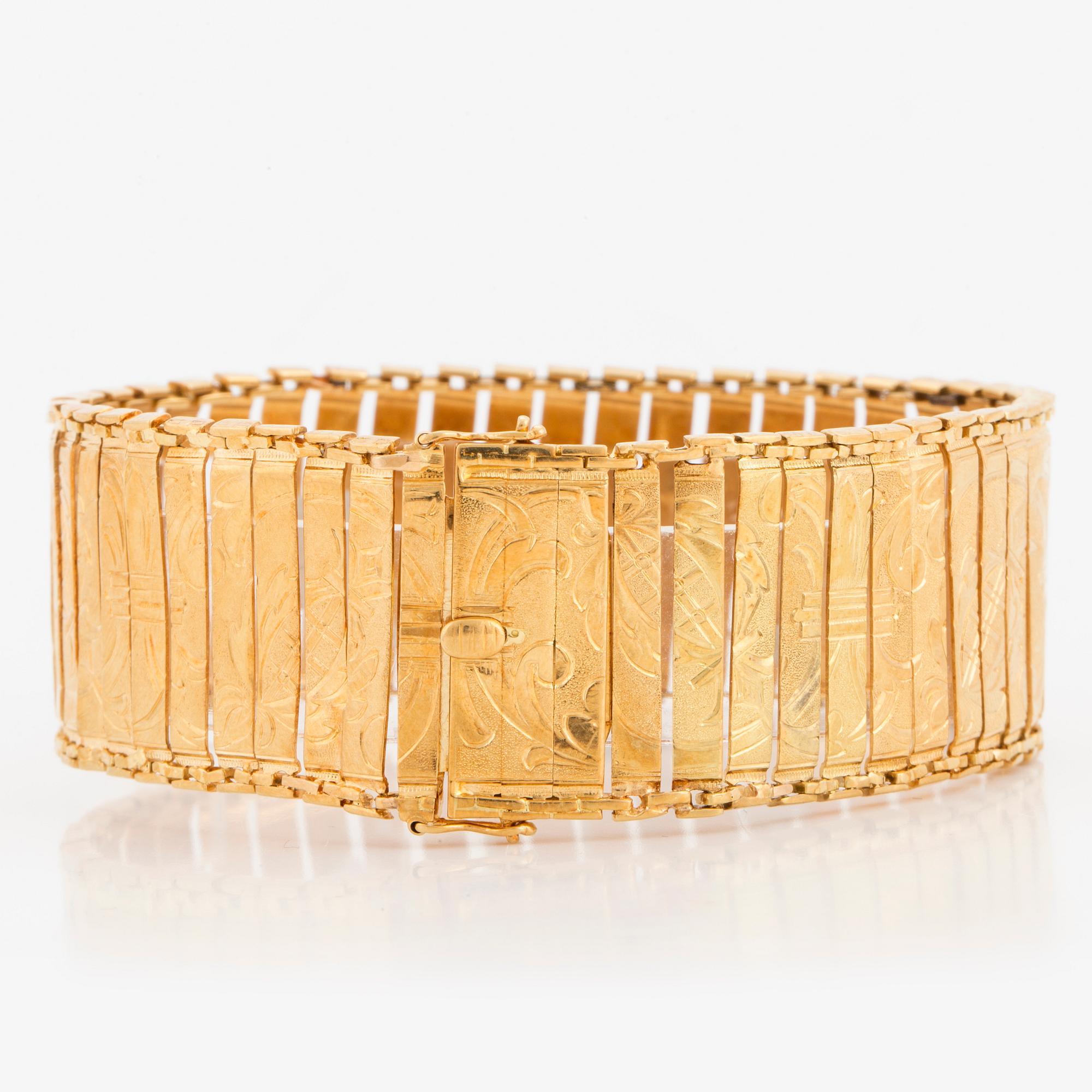 BRACELET, 18K gold with engraved decor.