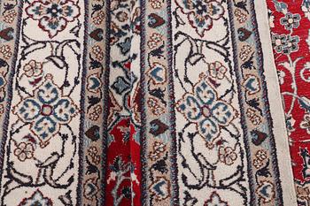 A carpet, Nain, part silk, 9 laa, c. 303 x 198 cm.