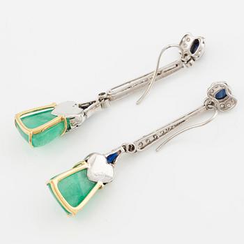 A pair of 18K gold earrings with emeralds, sapphires, and round brilliant-cut diamonds.