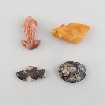 A group of eight Chinese stone charms / pendants, 20th century.