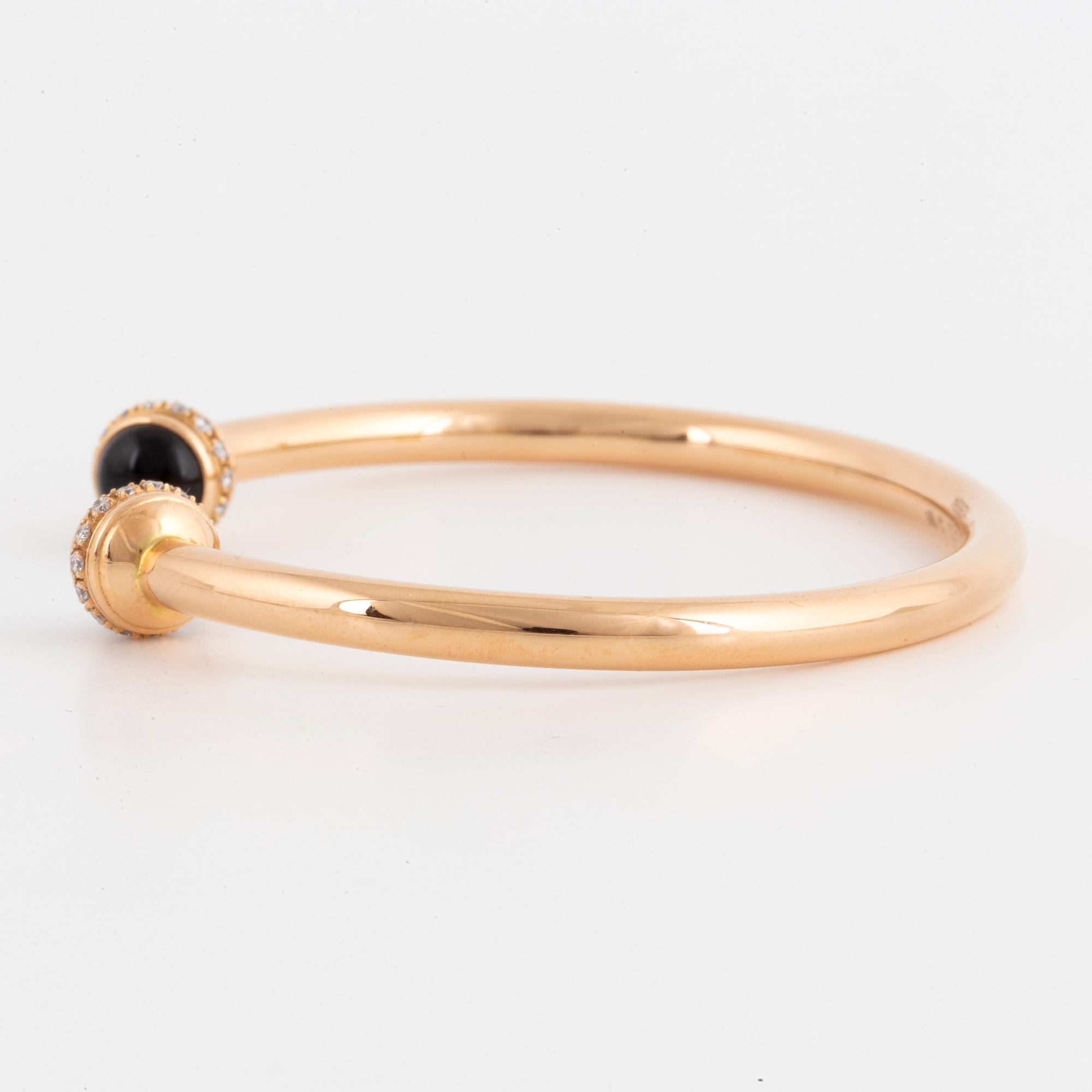 Piaget 18K rose gold, brilliant-cut diamonds and onyx cabochons.