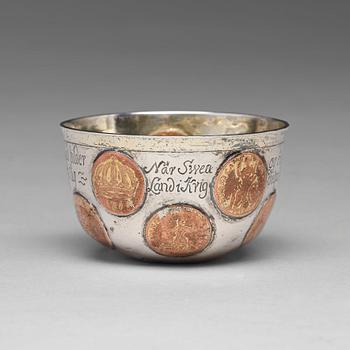 169. A Swedish 18th century parcel-gilt tumbler with copper coins, mark of Mikael Hammberg, Harnosand (-1758-1789(1790)).