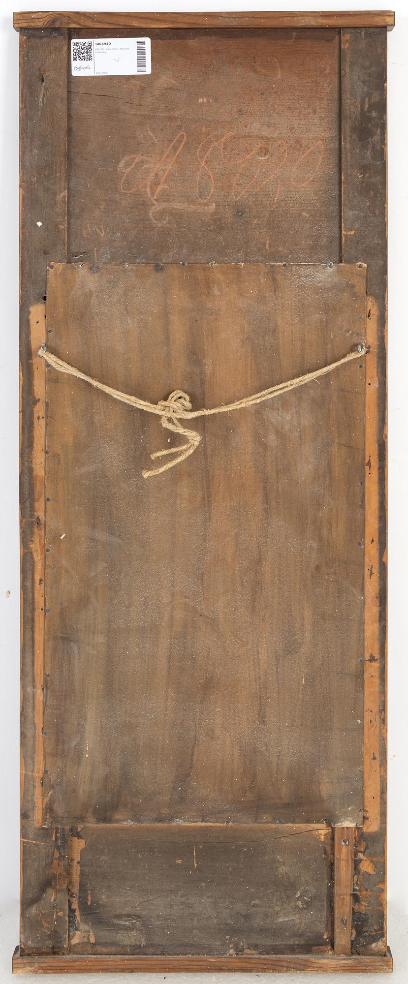 A mahogany veneered Empire mirror, first half of the 19th Century.