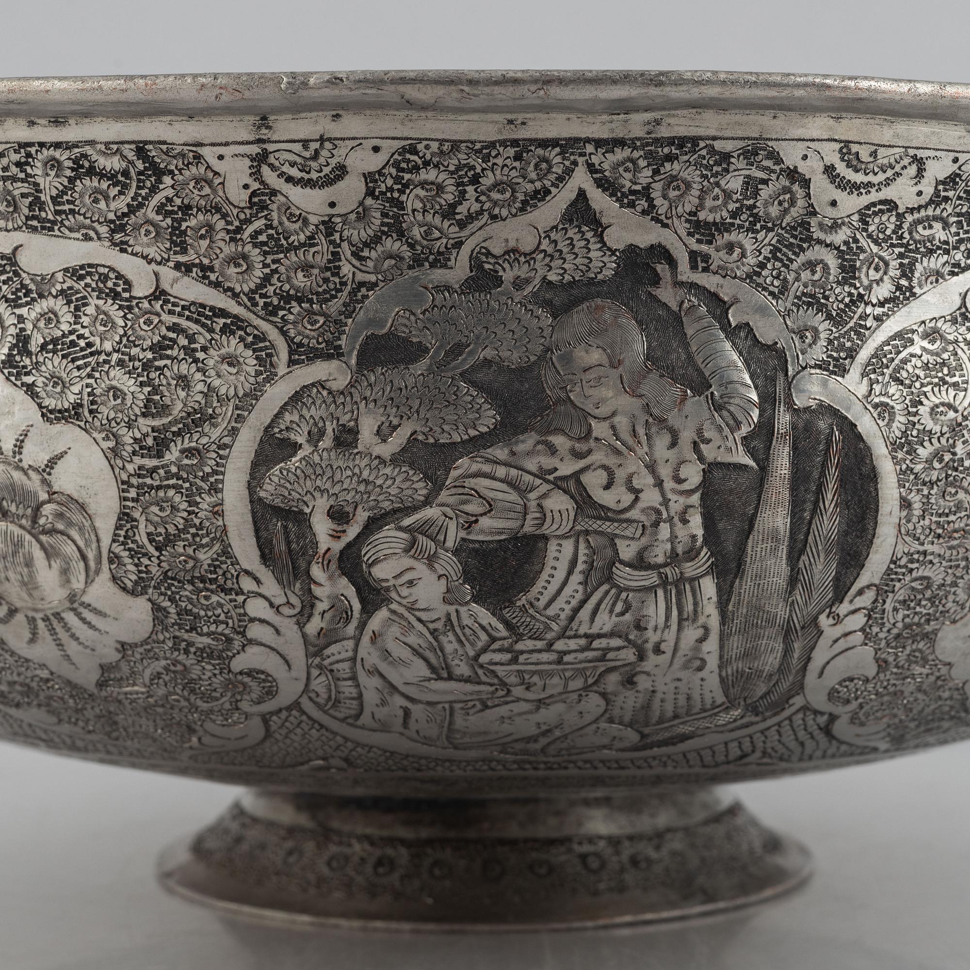 A west Asian repoussé silver and copper vessle, circa 1900.