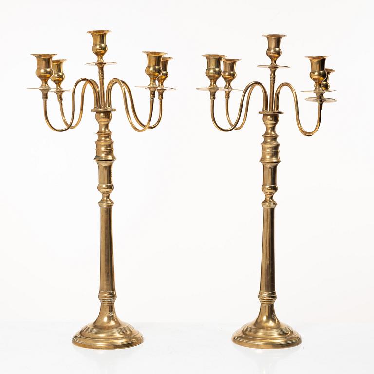A pair of brass candelabra, model N12, Nyköpings Bruk, Sweden, around 1900.