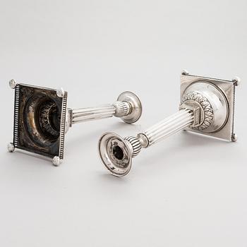 A pair of Swedish silver candlesticks, CG Hallberg, Stockholm 1901 and 1902.