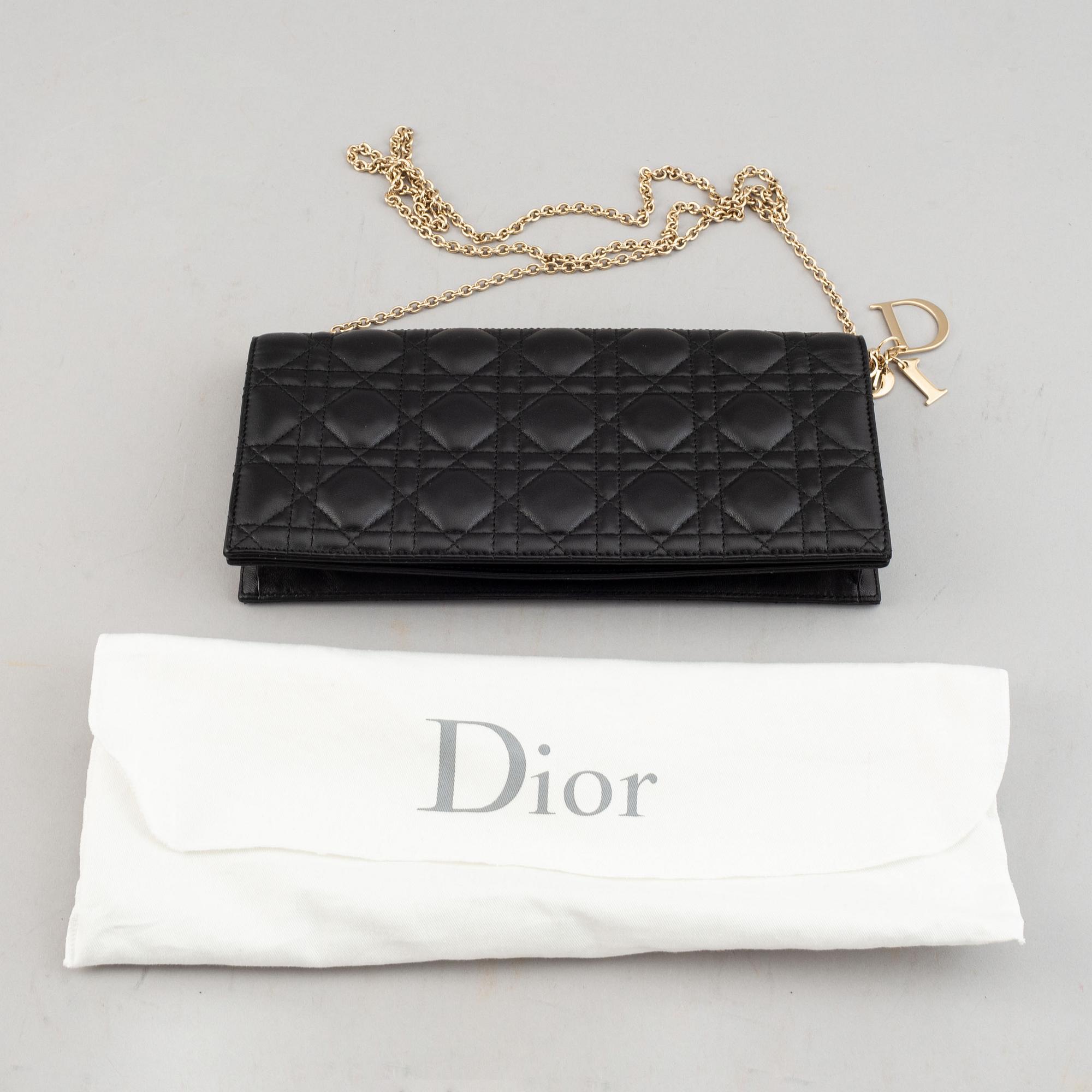 Christian Dior, a quilted leather handbag/clutch.