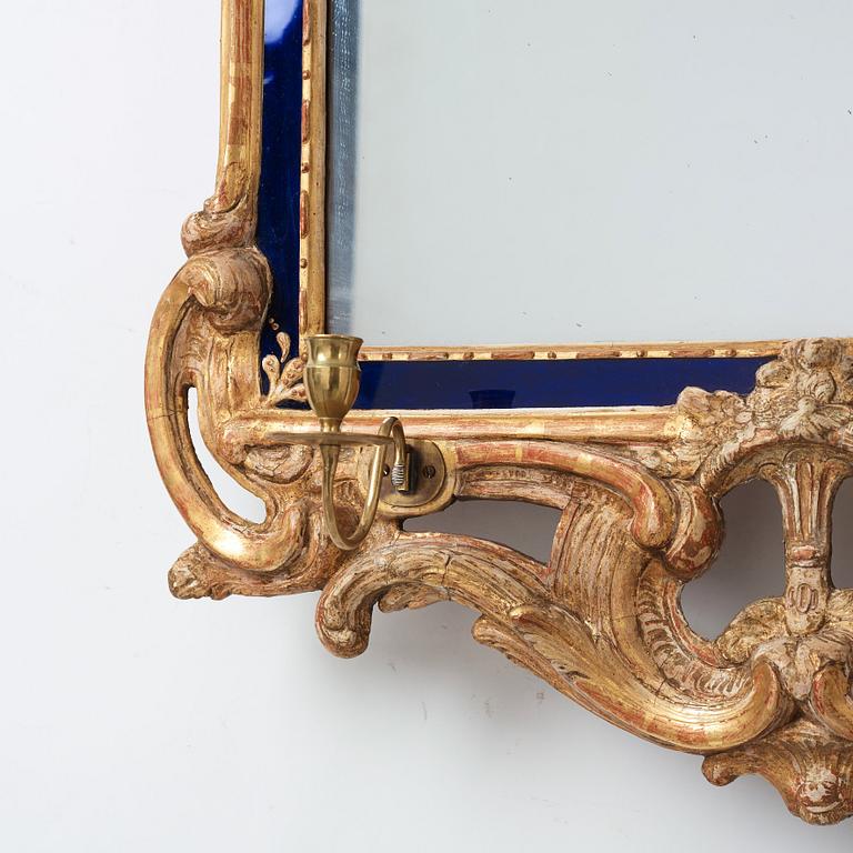 A Swedish Rococo two-light girandole mirror by Johan Åkerblad, dated 1769.