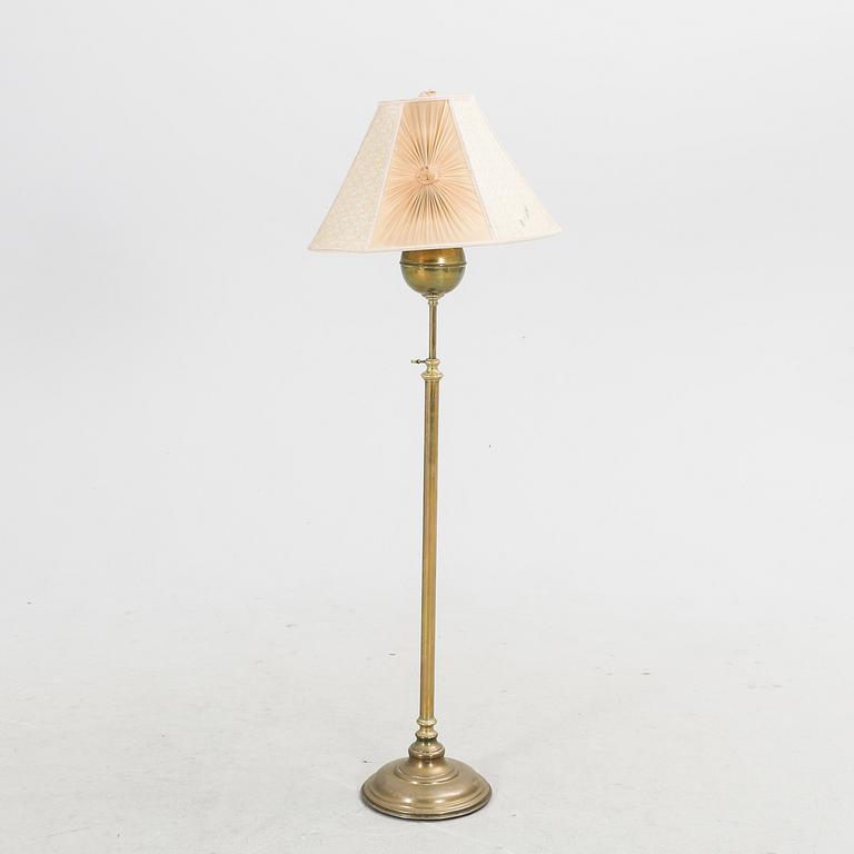 An early 1900s brass floor lamp.