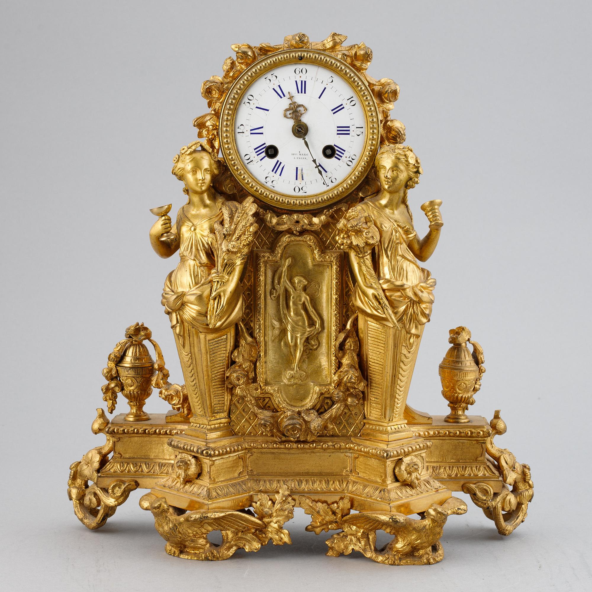 A French gilt bronze mantel clock from Henry Marc á Paris, second half of the 19th century.