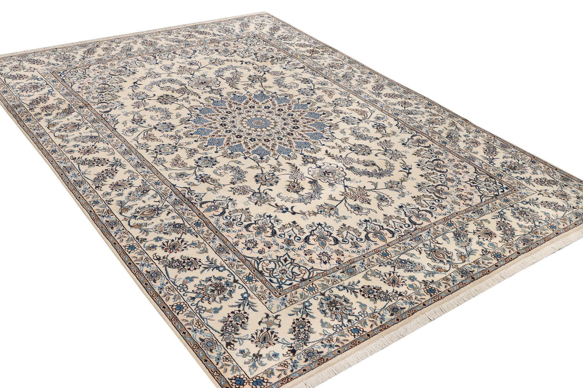 A Nain, part silk carpet, c. 337 x 244 cm.